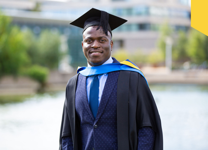Samson Lubega smiles on the UCD campus as he graduates from his Engineering degree