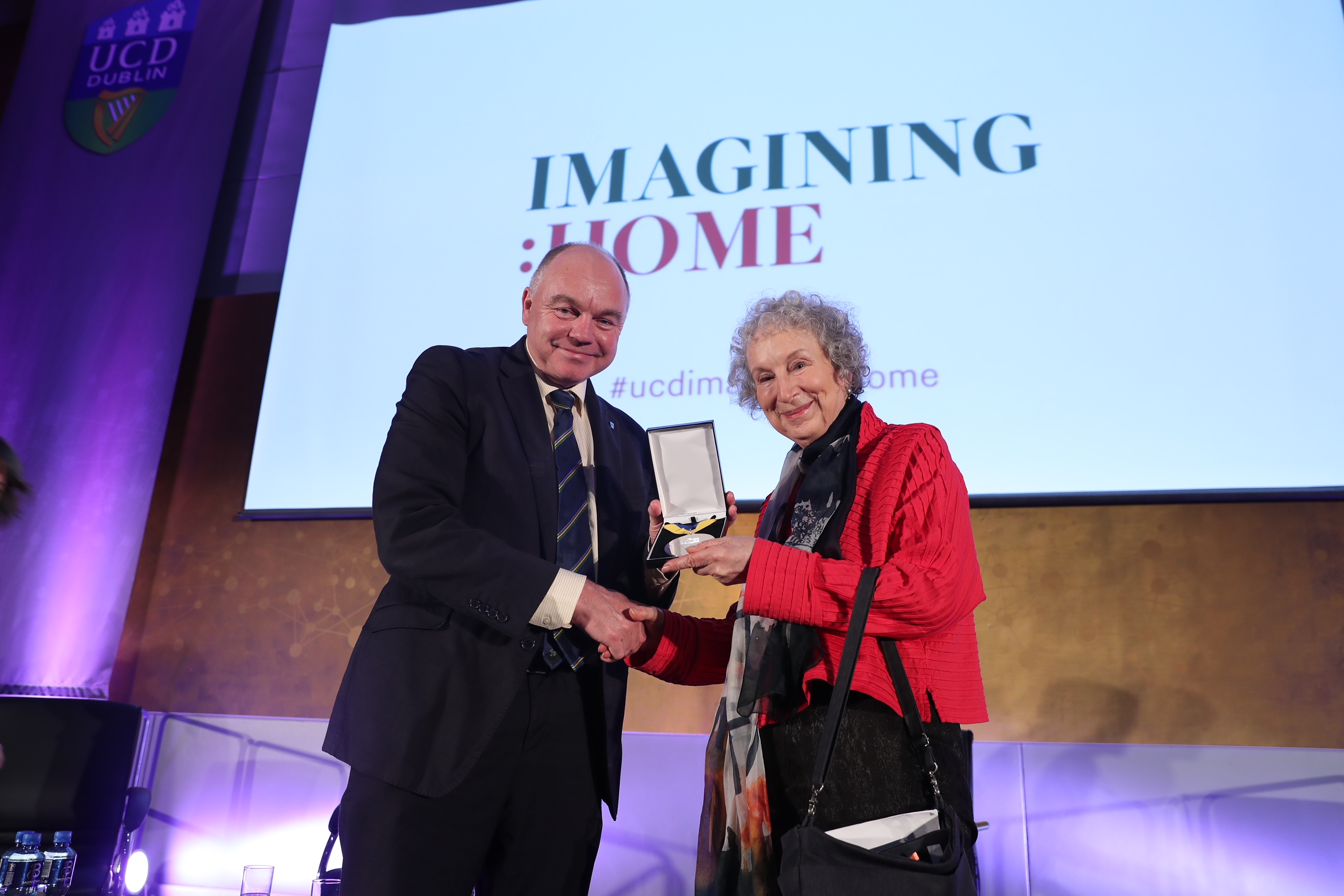 A photo of Margaret Atwood and her Ulysses Medal with President Andrew Deeks