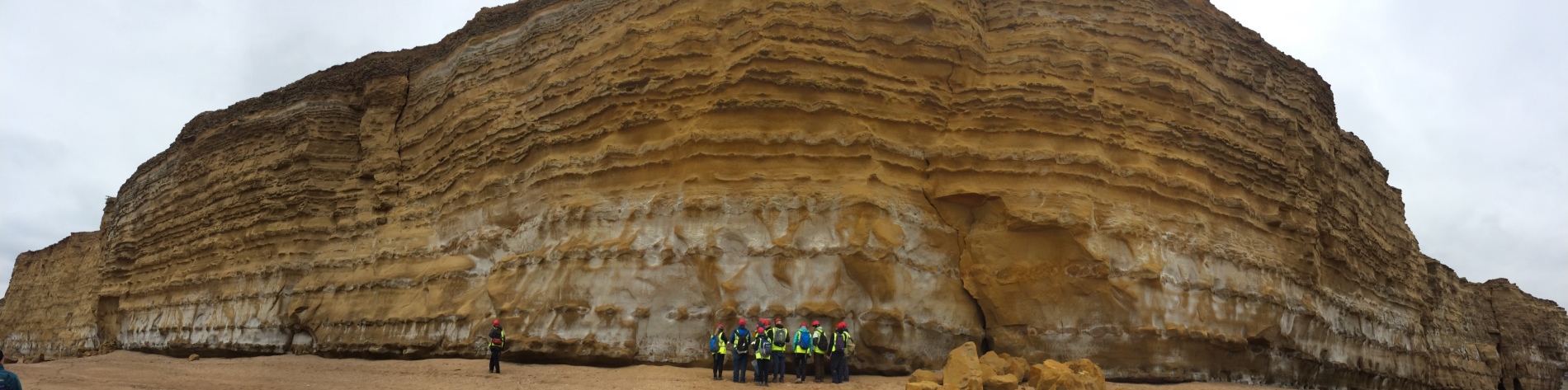 Students looking at a cliff face in England