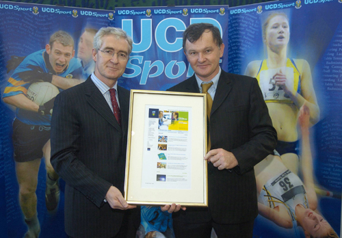 Dr Brendan Cuddihy (right) accepting a special award from Dr Hugh Brady, President of UCD, on behalf of his niece, UCD sports scholarship athlete, Joanne Cuddihy in recognition of her breaking the Irish 400m national record at the World Championships in Japan.