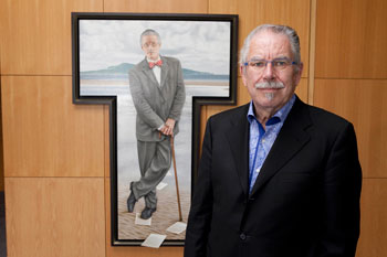Artist Robert Ballagh pictured with his portrait of James Joyce