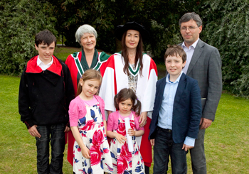 Dr Marina Carr, pictured with her family and Dr Cathy Leeney