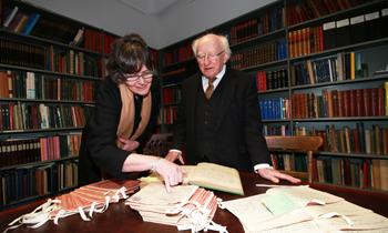The President of Ireland, Michael D Higgins views materials from the National Folklore Collection with Prof Ríonach uí Ógáin, Director, National Folklore Collection, University College Dublin
