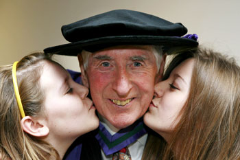 After receiving an honorary Doctor of Laws from UCD at an award ceremony in O'Reilly Hall, Belfield on 4 Dec 2006, Ireland's most famous Olympian, Ronnie Delany gets a kiss from his granddaughters Hollie 12 and Jodie 14