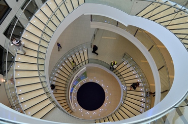 Image looking down from the top of a spiral staircase