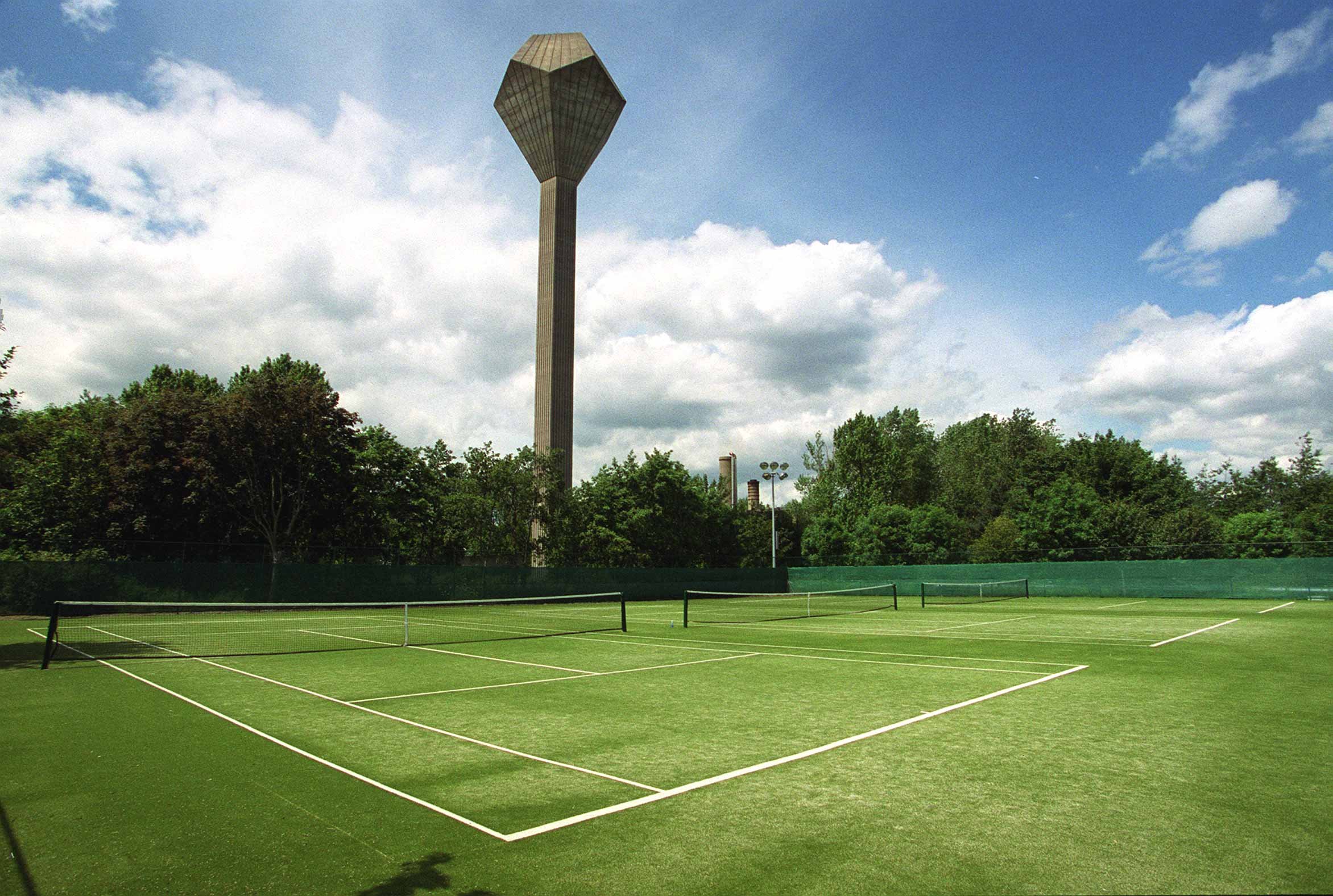 Tennis courts with the UCD water tower