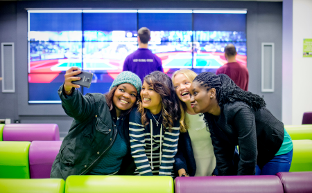 smiling students taking a selfie