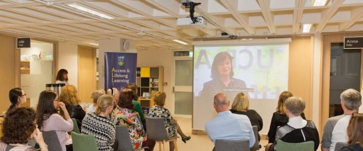 Attendees of our GAAD event watching a video presentation about digital accessibility