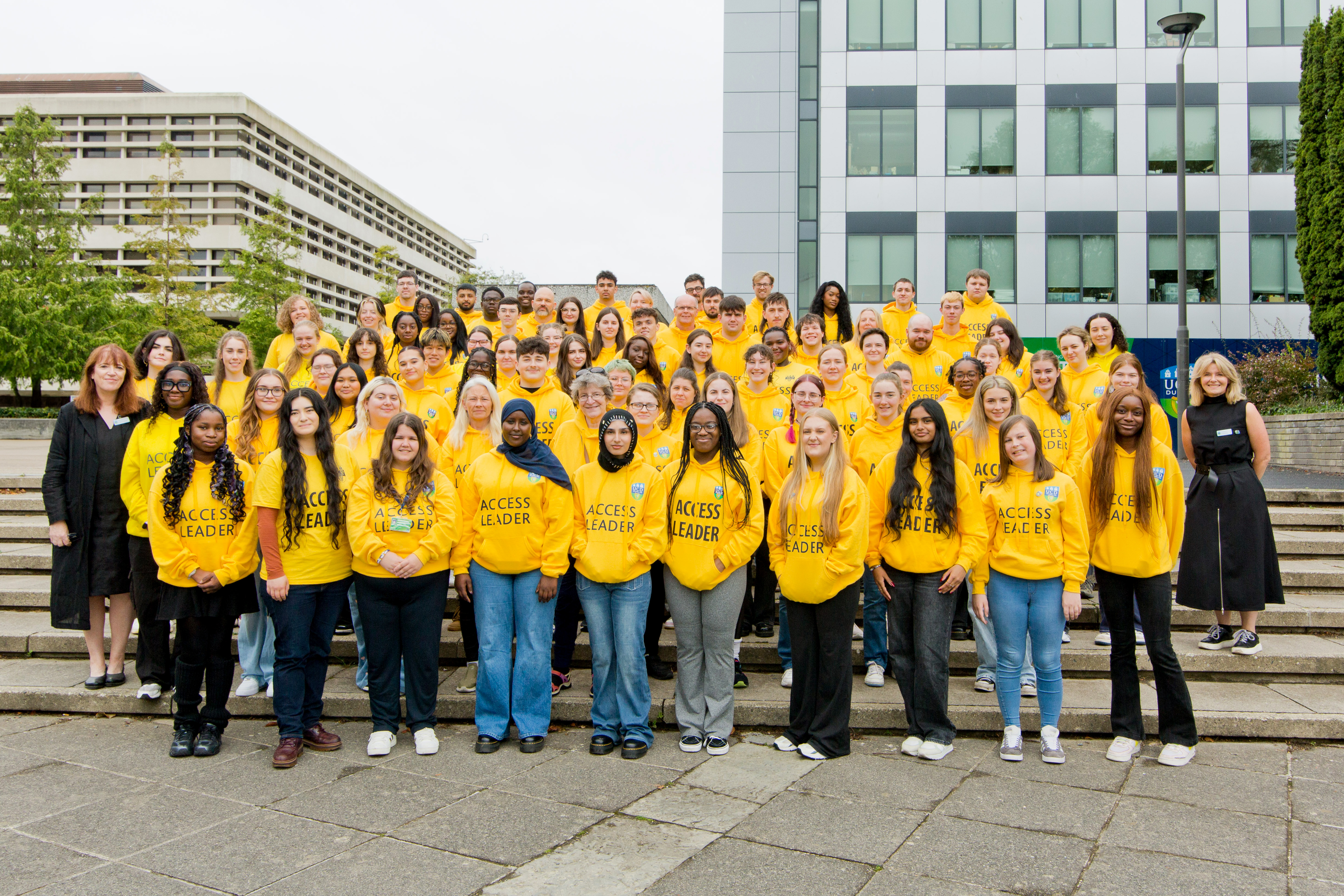 A large group of access leaders are posing together on the UCD Belfield campus