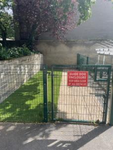 Fully Accessible Guide Dog Enclosure for guide dogs to relieve themselves.