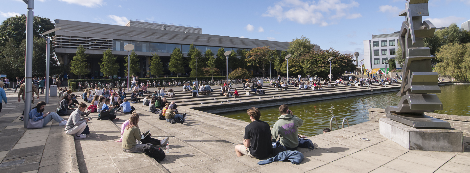 students sitting around UCD lake