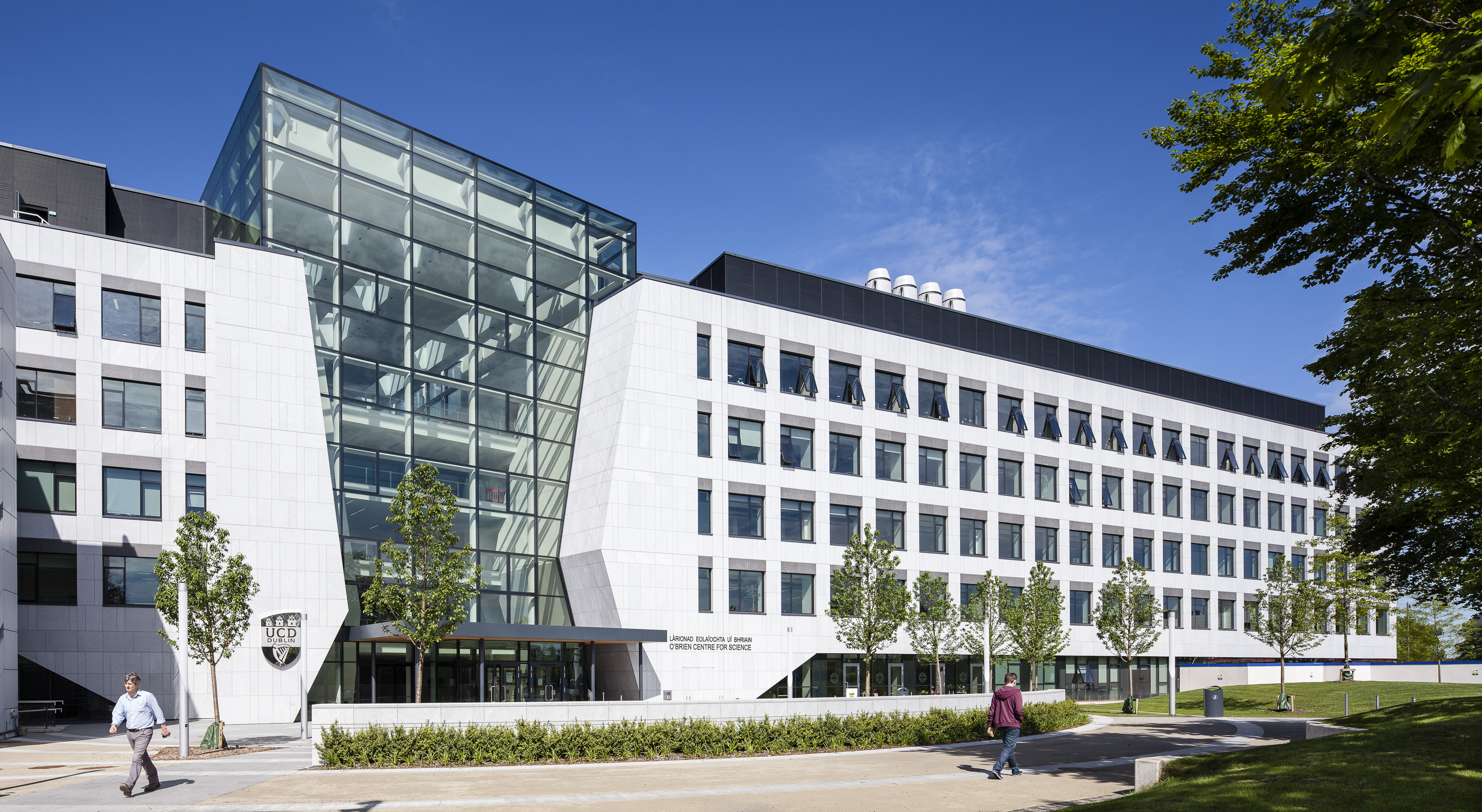A large white building with some glass front and some