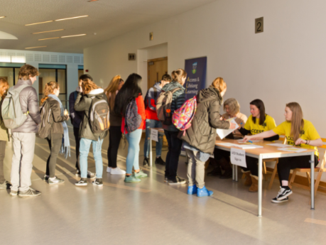 Students queuing at the Welcome desk for UCD Student Experience event