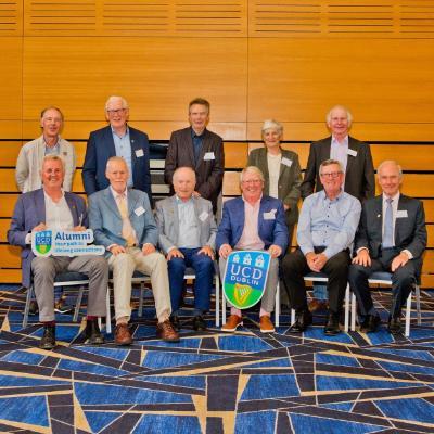 11 alumni posing for a photograph at their Golden and Diamond Reunion in O'Reilly Hall
