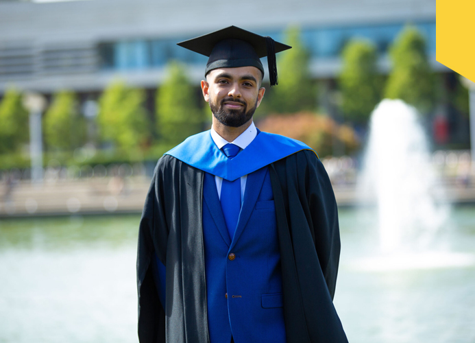 Ahmed Ashfaq on the day of his graduation, in front of the main lake at UCD Belfield campus