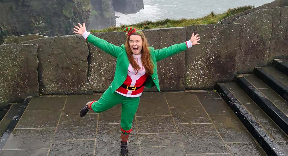 Study Abroad Image of the Cliffs of Moher with a student dressed as a leprechaun