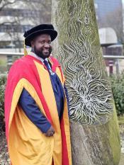 picture of person with honorary degree gowns