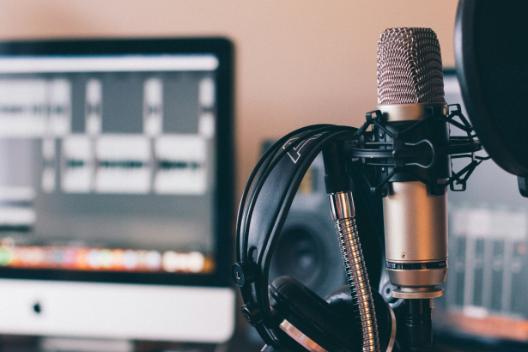 Mic in foreground with screen in background