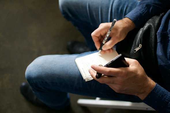 Journalist making notes