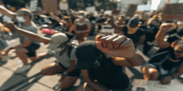 Crowd at peaceful protest, solidarity gesture