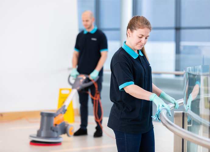 two people cleaning