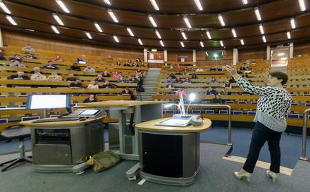 A lecturer in a lecture hall