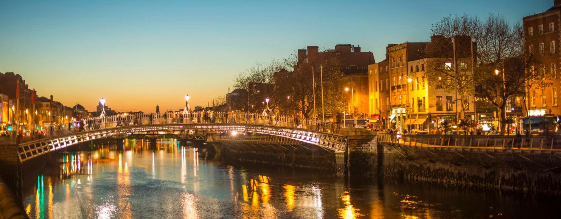 Night view of Dublin with the Hapenny across the Liffey