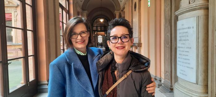 Two women side by side facing the camera.