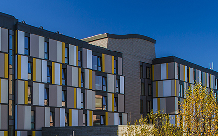 Building with yellow panels.