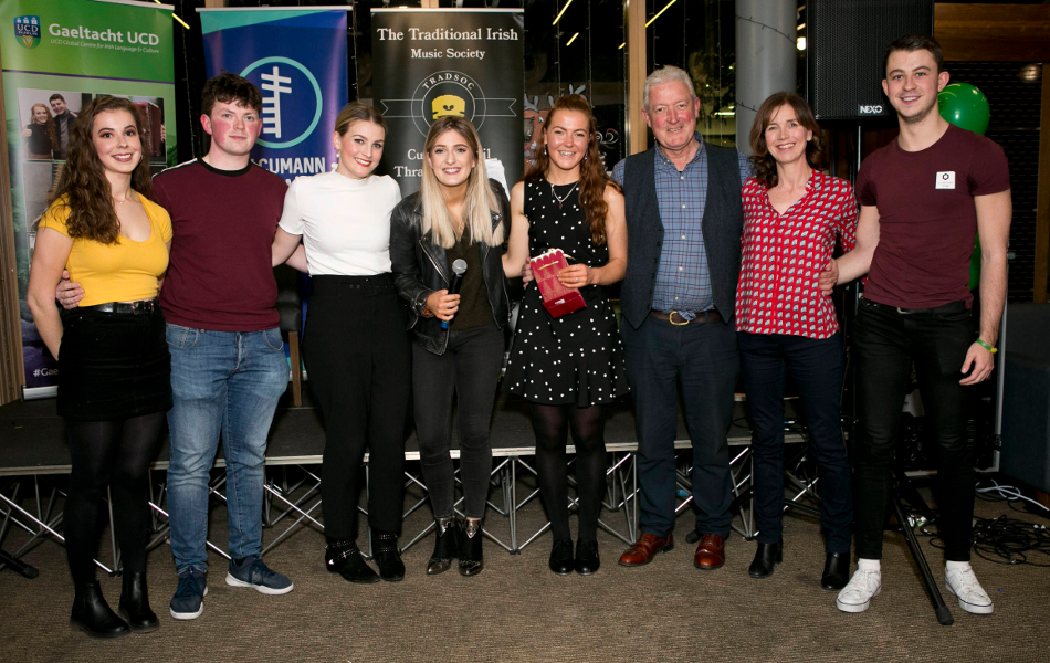 Fonn Steip & Ceoil UCD group of people with hands around each-other facing the camera