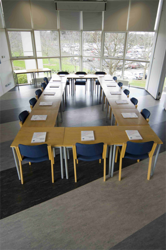 Boardroom style setup for up to 20 attendees.