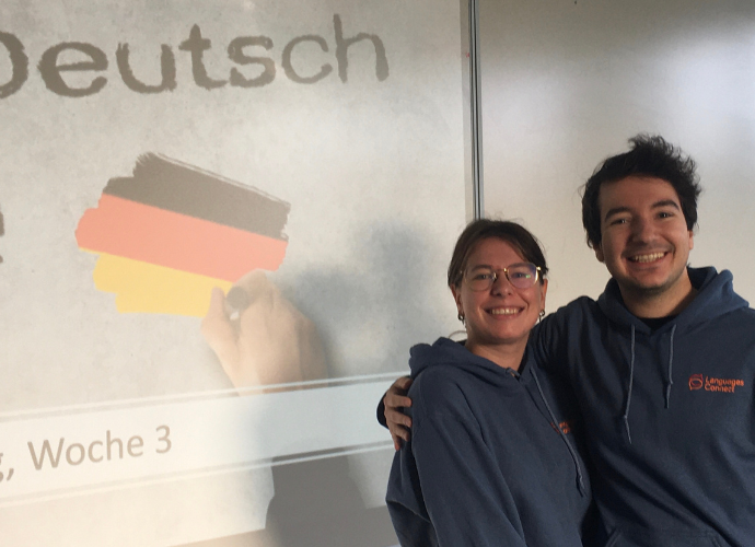 Two students in front of whiteboard