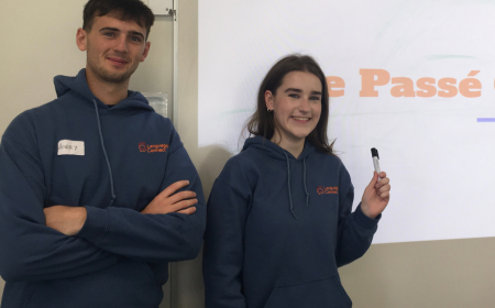 Two students in front of whiteboard