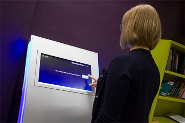 Laura Zaliene at Temp Library Card Kiosk JJL