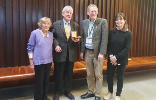 Prof Gerry Bury receiving award from Dr Fiona Bradley’s parents