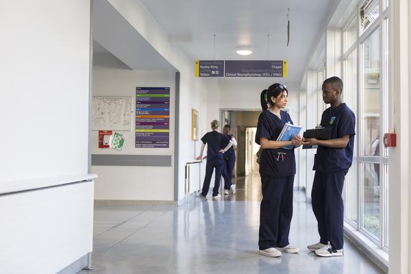 SVUH students talking in hospital corridor