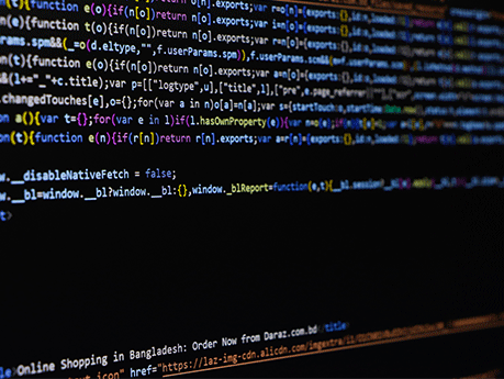 Software source code. Programming code. Programming code on computer screen. Developer working on program codes in office.