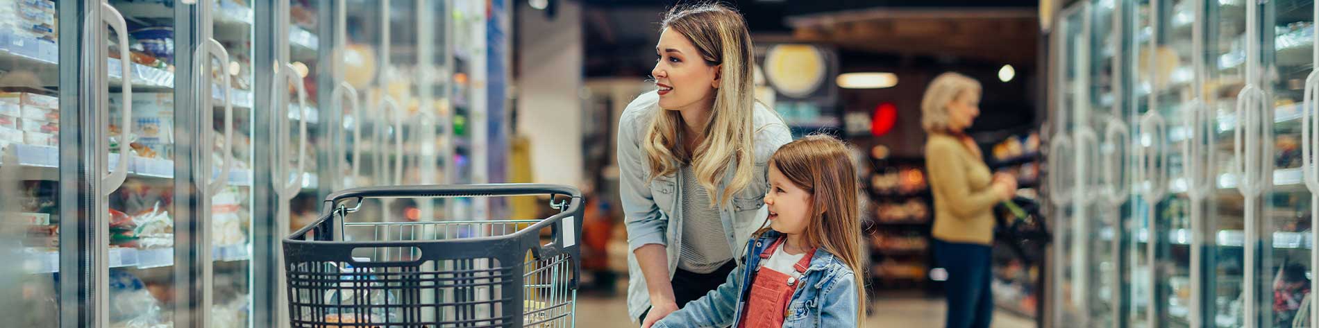 Woman and child in food aisle.