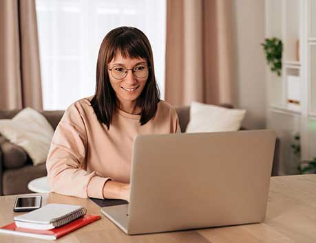 Woman looking at a computer.