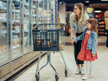 Woman and child in food aisle.