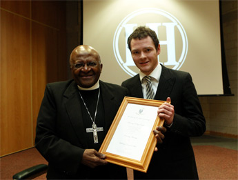 Ian Hastings, Auditor of the UCD L&H Society presents Archbishop Tutu with the Honorary Fellowship of the Society