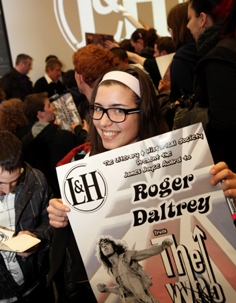Roger Daltrey (background) signing autographs for UCD students at the event