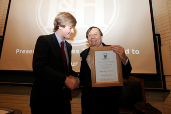 Conor McAndrews, Auditor of UCD Literary and Historical Society presents the James Joyce award to Barry Humphries