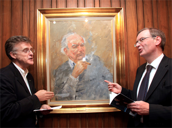 Patrick Mason (left) and Professor Anthony Roche pictured at the Abbey Theatre for the launch of Contemporary Irish Drama (Second Edition). In the centre is a portrait of the Irish playwright, Brian Friel by Basil Blackshaw