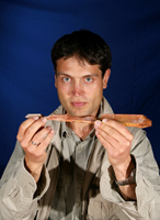 Nizar Ibrahim, PhD research scholar at the School of Medicine and Medical Science, University College Dublin who led the expedition, pictured with the jaw bone fragments of Alanqa saharica