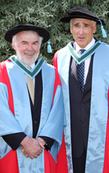 Tom Arnold (left) pictured with Matt Dempsey after receiving their honorary degrees from UCD