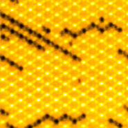 Pictured far right: Image representing 12 micrometer x 12 micrometer of artificial magnetic metamaterial where monopoles can be seen at each end of the Dirac strings, visible as dark lines. The dark regions correspond to magnetic islands where the magnetization is reversed. (Image courtesy of Paul Scherrer Institute) 