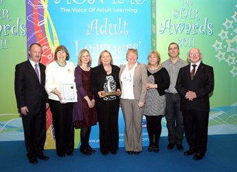 Pictured at the awards: L to R: Sean Haughey, Minister for Lifelong Learning; Dr. Mary Ellen McCann, (School of Applied Social Science); Edel Quinn, (MQI); Dr. Hilda Loughran, (School of Applied Social Science); Catherine Mary Doyle, (Social Science student, UCD); Olga Howlett, (An Cosán); Karl O'Brien, (Urrús); Michael D. Higgins, T.D.