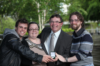 Pictured at the award ceremony with his UCD Medal: Dermot McElwaine and his children (l-r) Mark, Rachel and Paul