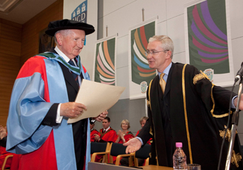 Dr Brian Sweeney recieving his honorary doctorate from UCD President, Dr Hugh Brady